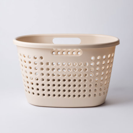 This cream plastic laundry basket features a modern design with open holes for ventilation. Ideal for home organization, it combines functionality with style.の素材
