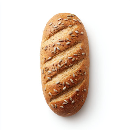 This image showcases a freshly baked brown bread loaf topped with seeds, ideal for various culinary applications including bakery promotions and healthy eating concepts.の素材