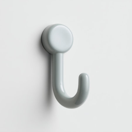 This image features a sleek white wall hook, perfect for enhancing organization in contemporary spaces. Its minimalistic design complements various interior aesthetics.の素材