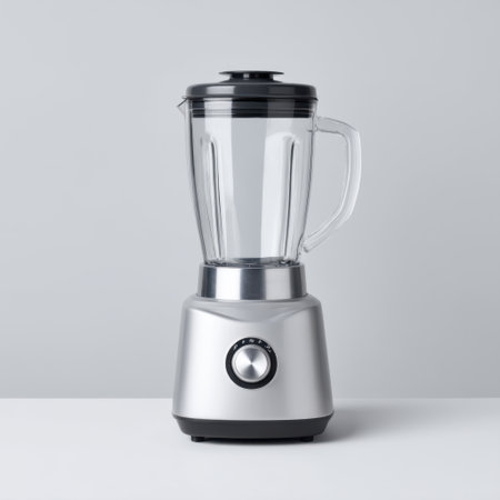 A sleek silver blender with a clear jar and black lid, perfect for smoothie enthusiasts and home chefs. Its modern design enhances any kitchen decor.の素材