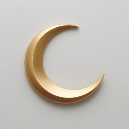 An elegant gold crescent moon shape is artistically displayed on a soft white background, presenting a modern and minimalist aesthetic ideal for decoration or design projects.の素材