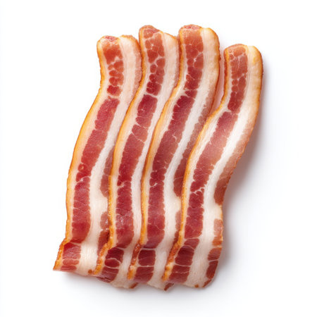High-quality image of freshly sliced bacon strips showcasing crispy edges and rich color, ideal for food blogs, restaurant menus, and culinary promotions.の素材