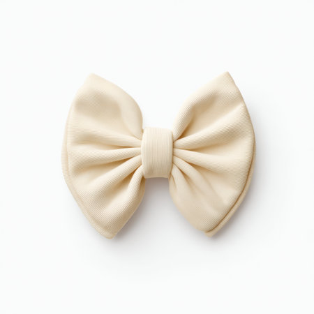 This elegant cream bow features a textured design and a chic shape, perfect for fashion applications, creative projects, and stylish presentations.の素材