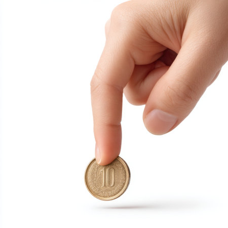 An artistic close-up of a hand grasping a ten-unit coin, showcasing themes of currency, value, and finance. Ideal for representations of economic concepts and transactions.の素材