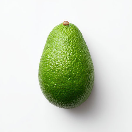 This image features a fresh ripe avocado with a vibrant green color and smooth texture, ideal for health-focused content, culinary recipes, and food presentations.の素材