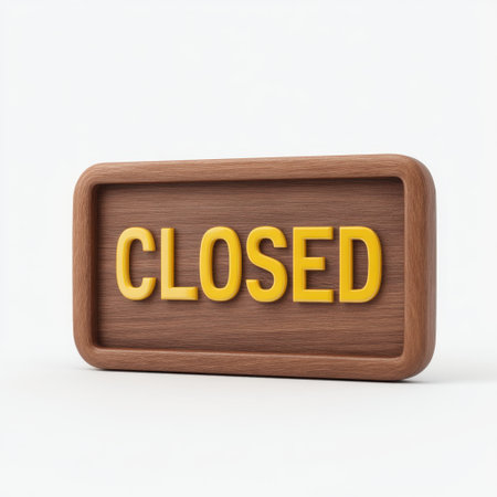 A wooden sign featuring the word "Closed" in bright yellow letters, set against a light background. This image represents temporary business closure or shut down.の素材