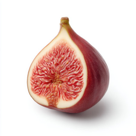 This image features a freshly cut ripe fig, highlighting its intricate interior texture and vibrant colors. Perfect for use in culinary and health-related projects.の素材