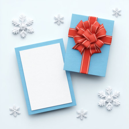 A vibrant gift box adorned with a striking red ribbon and bow rests on a soft blue background, surrounded by decorative snowflakes, suitable for seasonal greetings.の素材