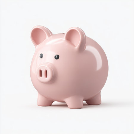 Bright and cheerful pink piggy bank against a white backdrop, perfect for representing savings, money management, and financial literacy in educational materials.の素材