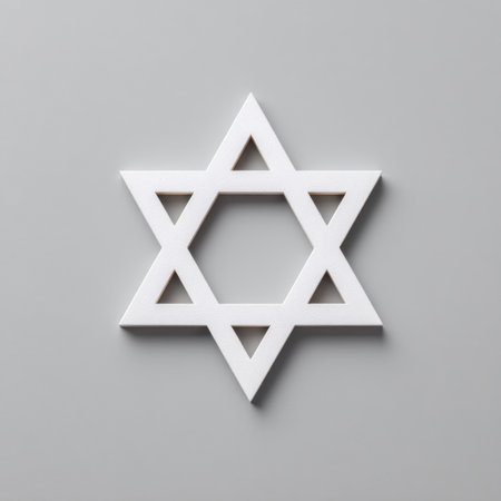 A clean and simple image of the Star of David in white against a soft gray background, representing Jewish culture and spirituality with modern minimalist aesthetics.の素材