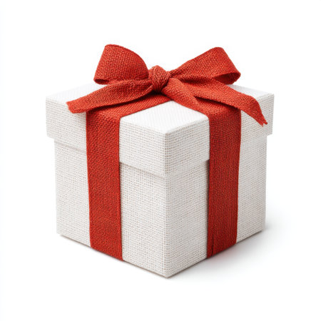 This elegant white gift box is accented with a bright red ribbon, making it an ideal choice for birthdays, holidays, and special occasions. Perfect for any celebration.の素材