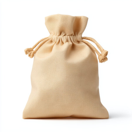 This natural beige drawstring bag offers a perfect blend of style and functionality, ideal for storing small items or gifts in a minimalist design.の素材