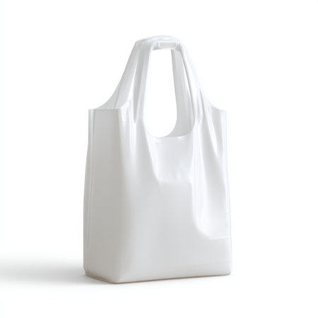 A minimalist white plastic bag set against a clean background, symbolizing consumer habits and the ongoing conversation about eco-friendly shopping alternatives.の素材