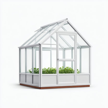 A modern greenhouse featuring a sleek design with clear glass panels and a white frame. Ideal for growing plants in a controlled environment, perfect for home gardening.の素材
