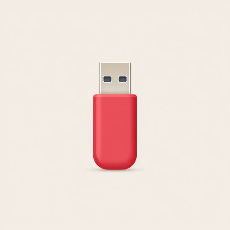 A bright red USB flash drive stands out against a minimalist beige background, perfect for themes of technology, storage solutions, and modern design aesthetics.の素材
