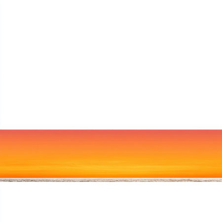 A stunning sunset casts vibrant hues across the horizon, creating a tranquil scene over gentle ocean waves. This colorful beach landscape evokes peace and relaxation.の素材