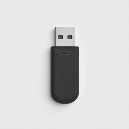 A sleek black USB flash drive showcasing a metallic connector, designed for efficient data storage and transfer in various modern technology applications.の素材