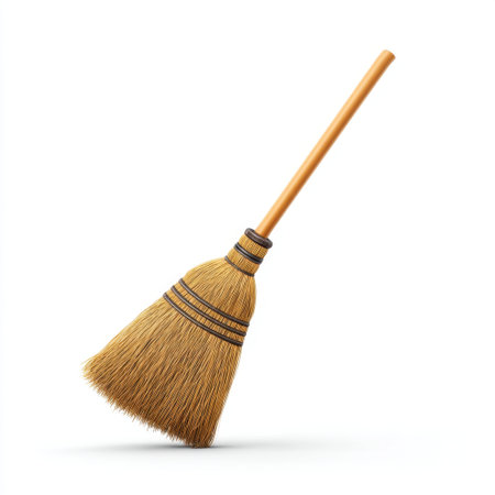 Isolated straw broom with a wooden handle, showcasing a traditional cleaning tool that adds a rustic touch to any space, ideal for home decor or practical use.の素材
