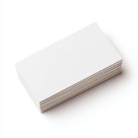 A stack of blank business cards displayed on a clean white background, perfect for showcasing designs or branding ideas in a professional environment.の素材