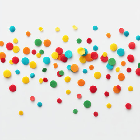 A vibrant mix of round felt pieces in various colors scattered on a clean white background, ideal for arts, crafts, decorations, and creative projects.の素材