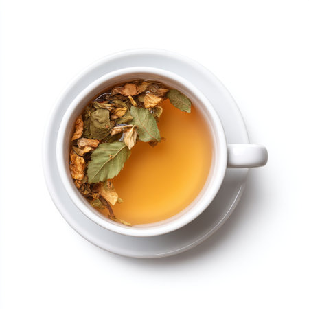 A serene image of herbal tea with dried leaves in a white cup. The warm infusion offers a calming vibe, making it perfect for relaxation or wellness themes.の素材