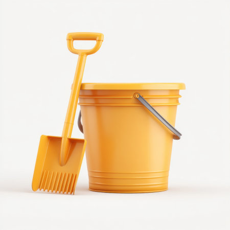 This image features a bright yellow plastic bucket alongside a matching shovel, perfect for outdoor activities, gardening, or children's play with sand.の素材