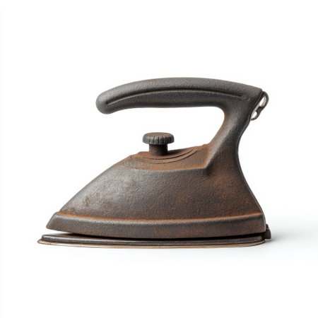 This vintage cast iron clothing iron features a rustic design with a wooden handle, ideal for capturing the essence of history and nostalgia in photography.の素材