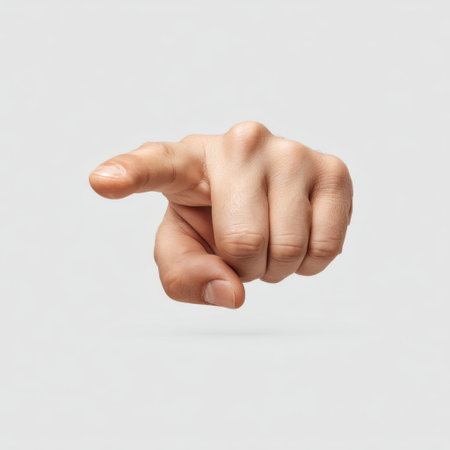 A close-up image of a human hand pointing forward, showcasing the gesture as a form of communication and direction against a soft gray backdrop.の素材
