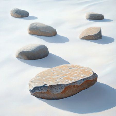 A collection of smooth stones arranged beautifully in a sandy environment, creating a peaceful and serene scene ideal for relaxation and meditation.の素材