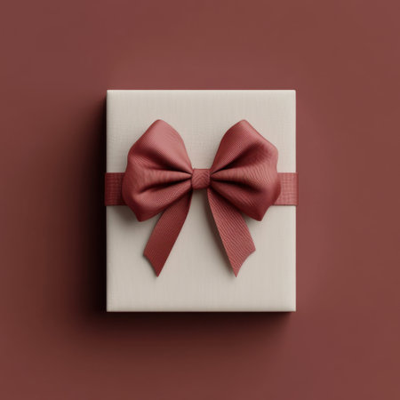 This image showcases a beautifully wrapped gift box adorned with a soft pink ribbon, elegantly set against a warm brown background, ideal for any occasion.の素材
