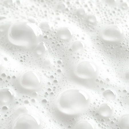 This close-up image features a mesmerizing arrangement of bubbles in creamy foam, perfect for illustrating culinary themes or beverage preparations with an artistic touch.の素材