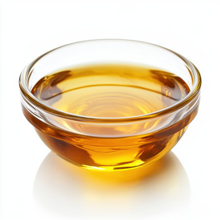 A clear glass bowl filled with rich amber liquid, ideal for food photography. This image captures the essence of culinary ingredients for recipe inspiration.の素材