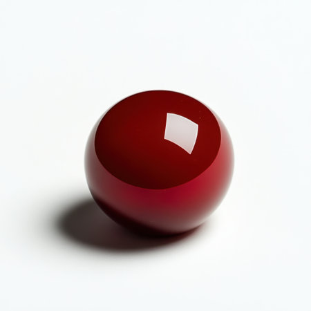 A vibrant glossy red sphere stands out against a clean white background, showcasing a beautiful reflection and soft shadows, perfect for artistic and modern designs.の素材