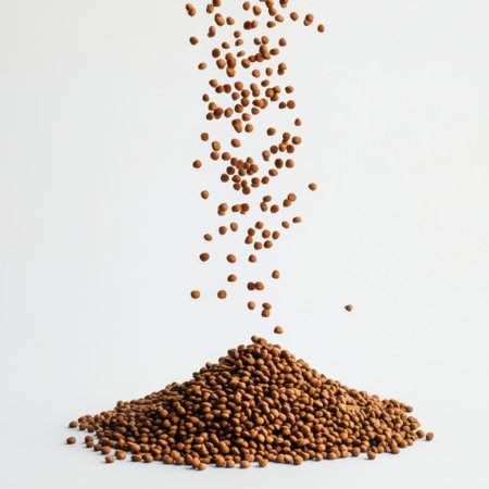 Captivating composition showcasing coffee beans suspended in the air above a mound of ground coffee, emphasizing richness and texture on a clean background.の素材