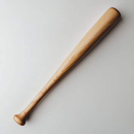 This image features a wooden baseball bat beautifully isolated on a white background, perfect for illustrating sports, fitness, and recreational activities.の素材