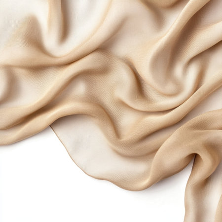 A beautiful beige silk fabric drapes gracefully, showcasing its smooth texture and elegant flow. Perfect for fashion projects, backgrounds, and artistic designs.の素材