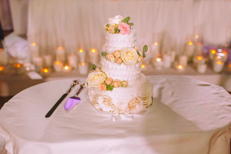 Birthday cake with candles, bright lights bokeh.の写真素材
