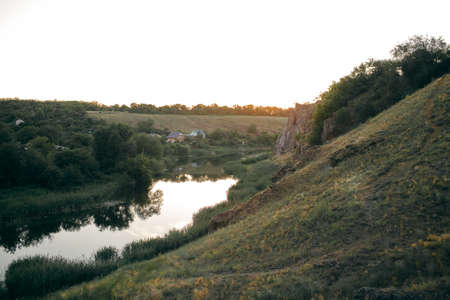 beautiful sunset over the river in the mountainsの写真素材