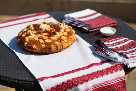bread with salt on an embroidered towel. Preparations for the holidayの写真素材