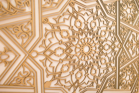 Beautiful pattern on the wall carved from wood in oriental styleの写真素材