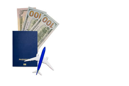 Biometric passport of a citizen with an airplane and dollars on a white background. International pass with personal information. Passport for international flights. Minimum set for border crossingの写真素材