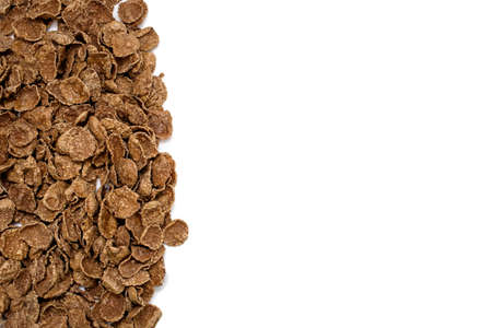 Background of brown sweet cereals with free space for text and advertising. The concept of a fast...