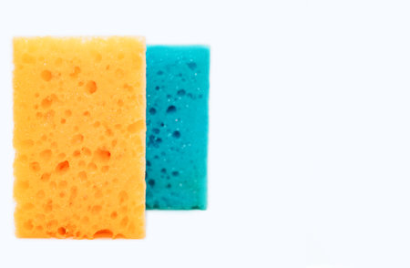 Sponges for washing dishes in the kitchen isolated on a white background with free space for text....