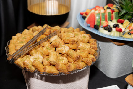 Traditional sweet Turkish dessert baklava. Honey baklava is filled with delicious pistachios and nuts. An exquisite nutty Arabic dessert, ideal for a treat at a holiday or wedding. Food concept photoの写真素材