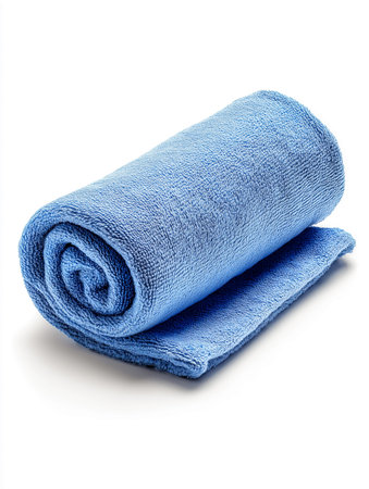 Blue microfiber towel rolled neatly on a white background, ideal for cleaning and drying tasks in homes, offices, or automotive settingsの素材