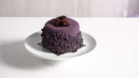 fresh and delicious blueberry cake on white plateの写真素材