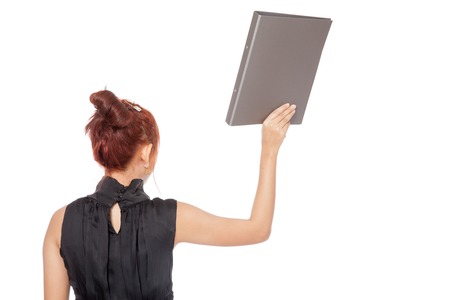Asian office girl turn back and show a folder isolated on white backgroundの写真素材