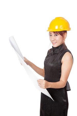 Asian architect girl read a blueprint look at camera isolated on white backgroundの写真素材
