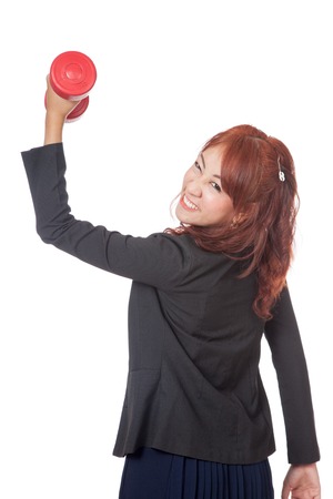 Asian office girl lift a red dumbbell over head isolated on white backgroundの写真素材