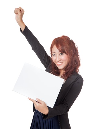 Asian office girl hold a blank sign and hand up happy with success isolated on white backgroundの写真素材